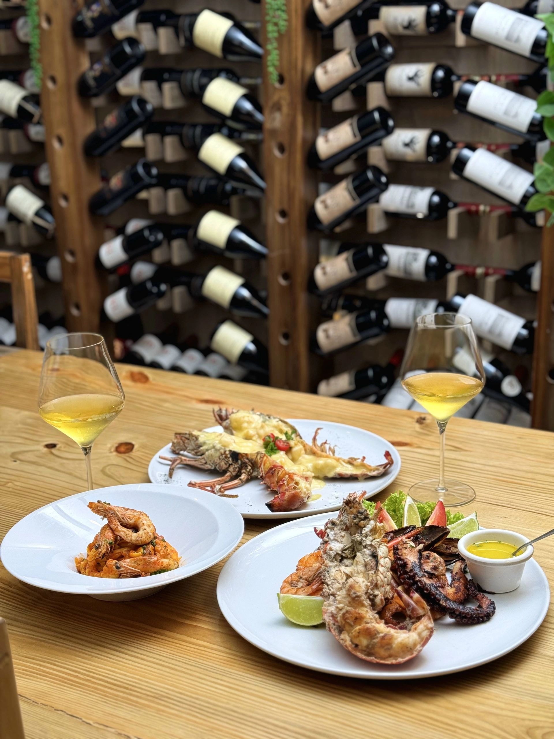 A celebration table with wine at Kaboclo